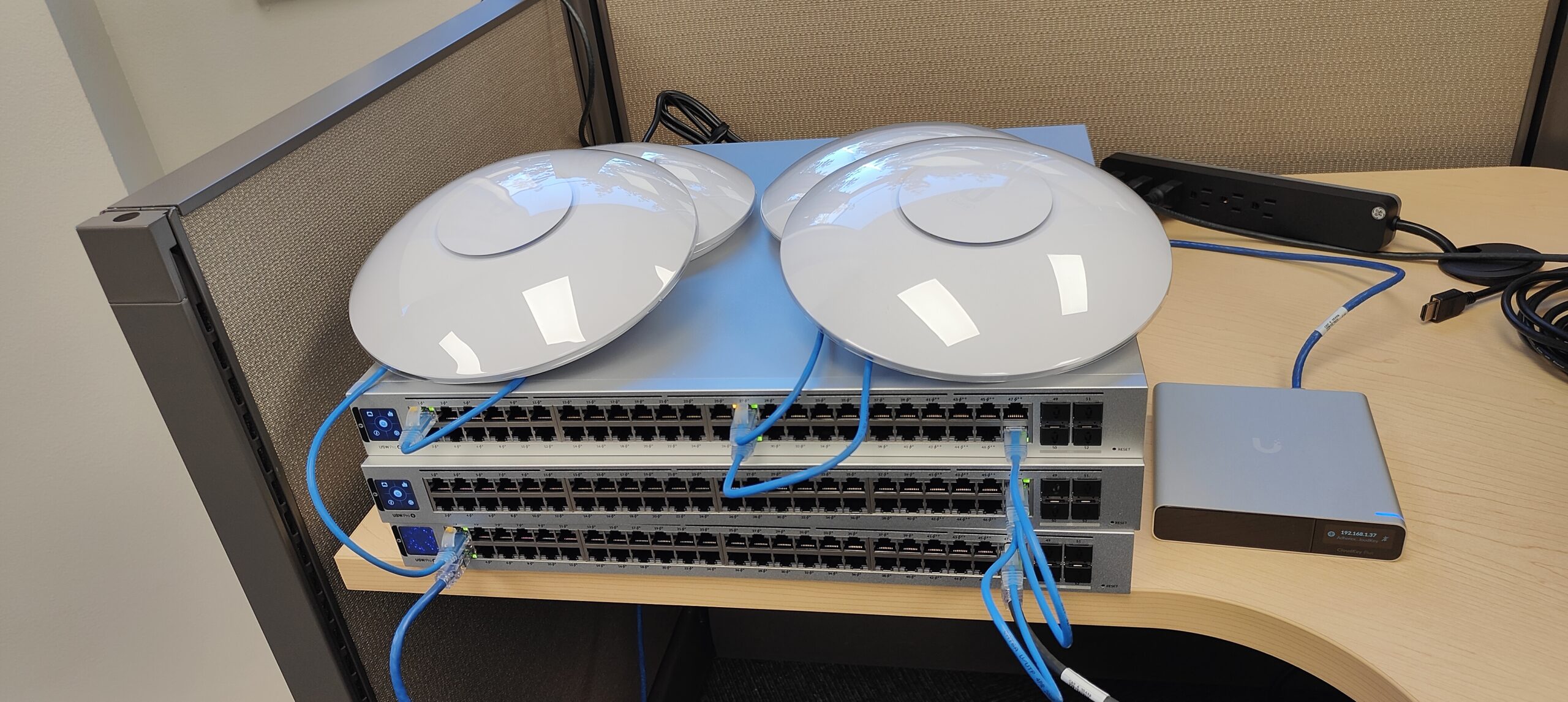 Ubiquiti networking devices: wireless access points, network switches being staged for deployment